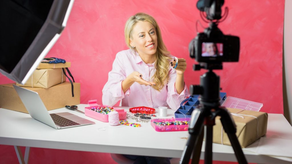 woman has a camera setup to make a how to video